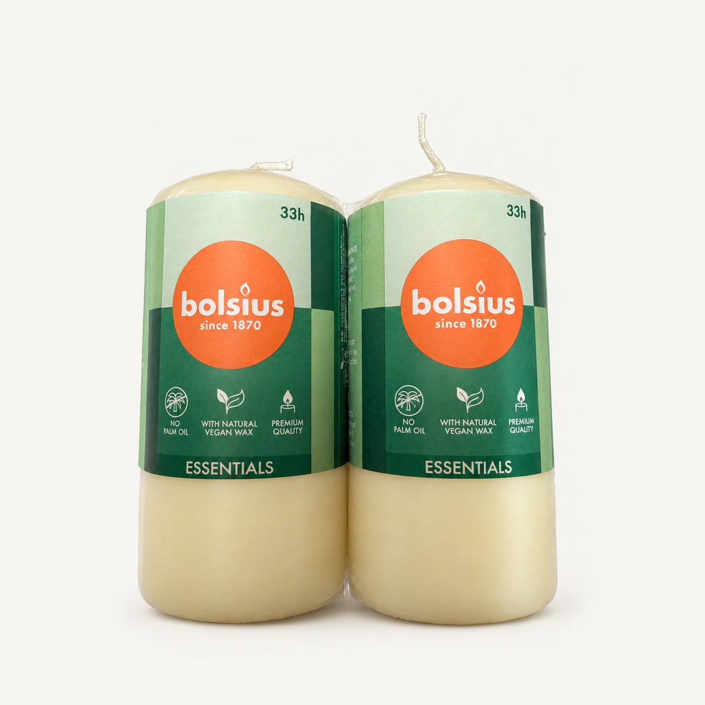 Two Bolsius Essentials ivory pillar candles, 33 hour burn time