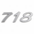 Silver-coloured aftermarket 718 badge set