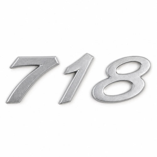 Silver-coloured aftermarket 718 badge set