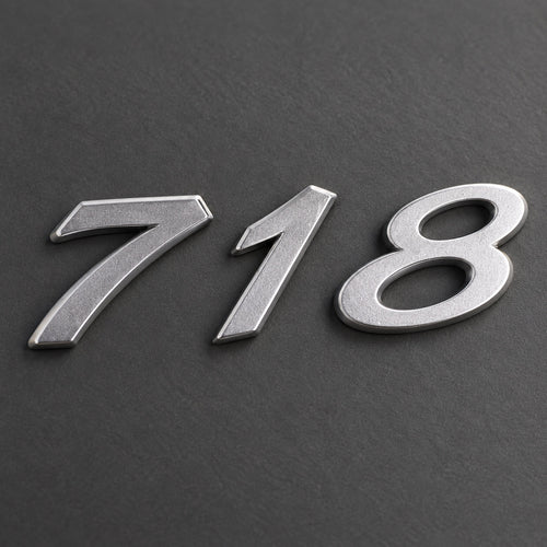 Silver-coloured aftermarket 718 badge set