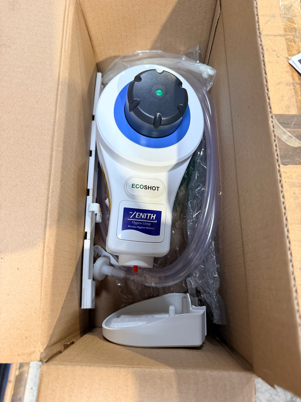 Brightwell Ecoshot dosing unit with Zenith Hygiene branding in its box