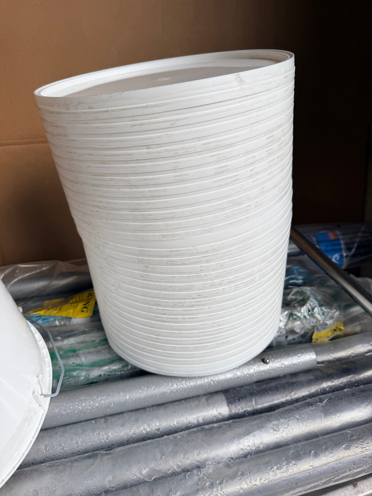 Stack of 27 white lids for the 10 litre buckets