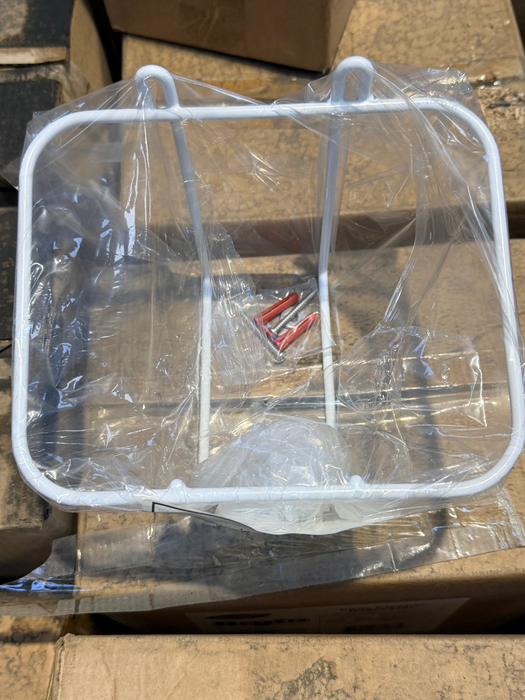 Diversey white wire 5L bottle holder with screws and wall plugs in bag – actual stock