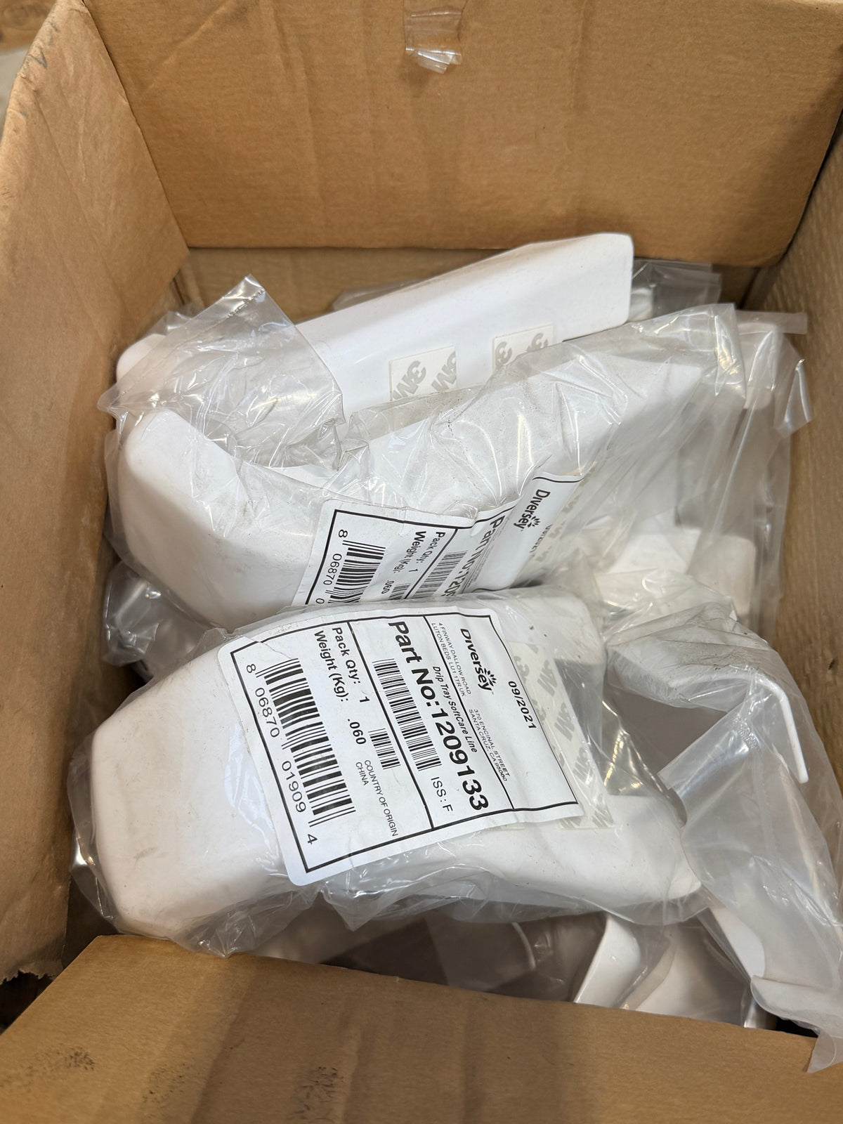 Box of bagged Diversey Soft Care Line drip trays – actual stock