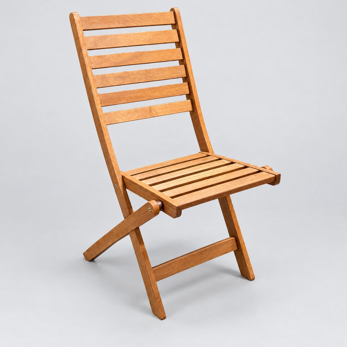Wooden slatted folding garden chair – studio image