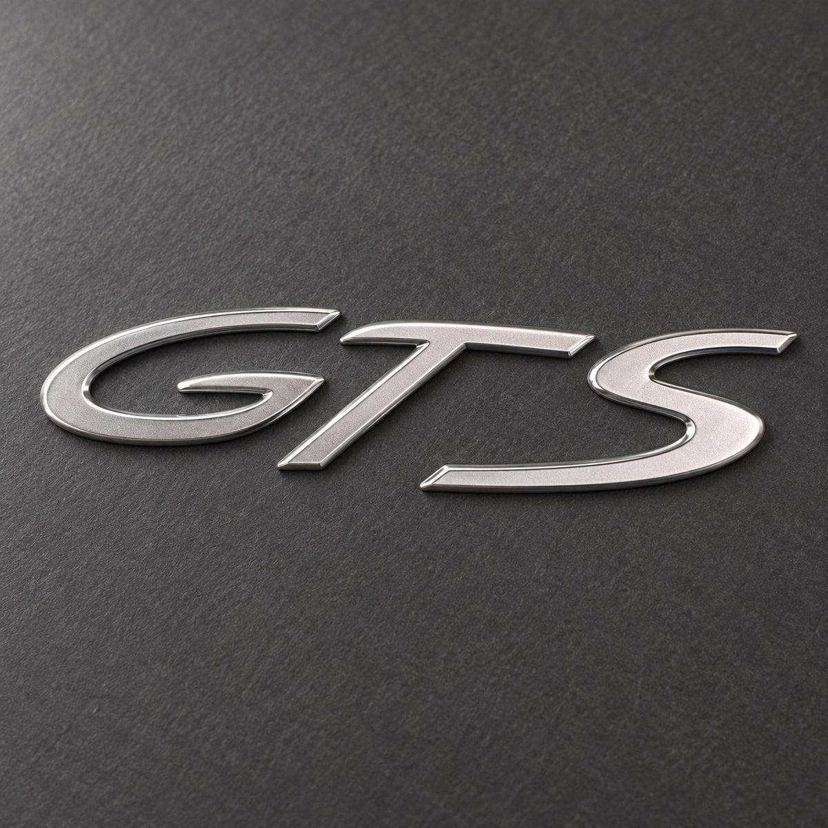Silver-coloured aftermarket GTS badge set