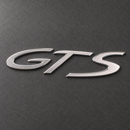 Silver-coloured aftermarket GTS badge set