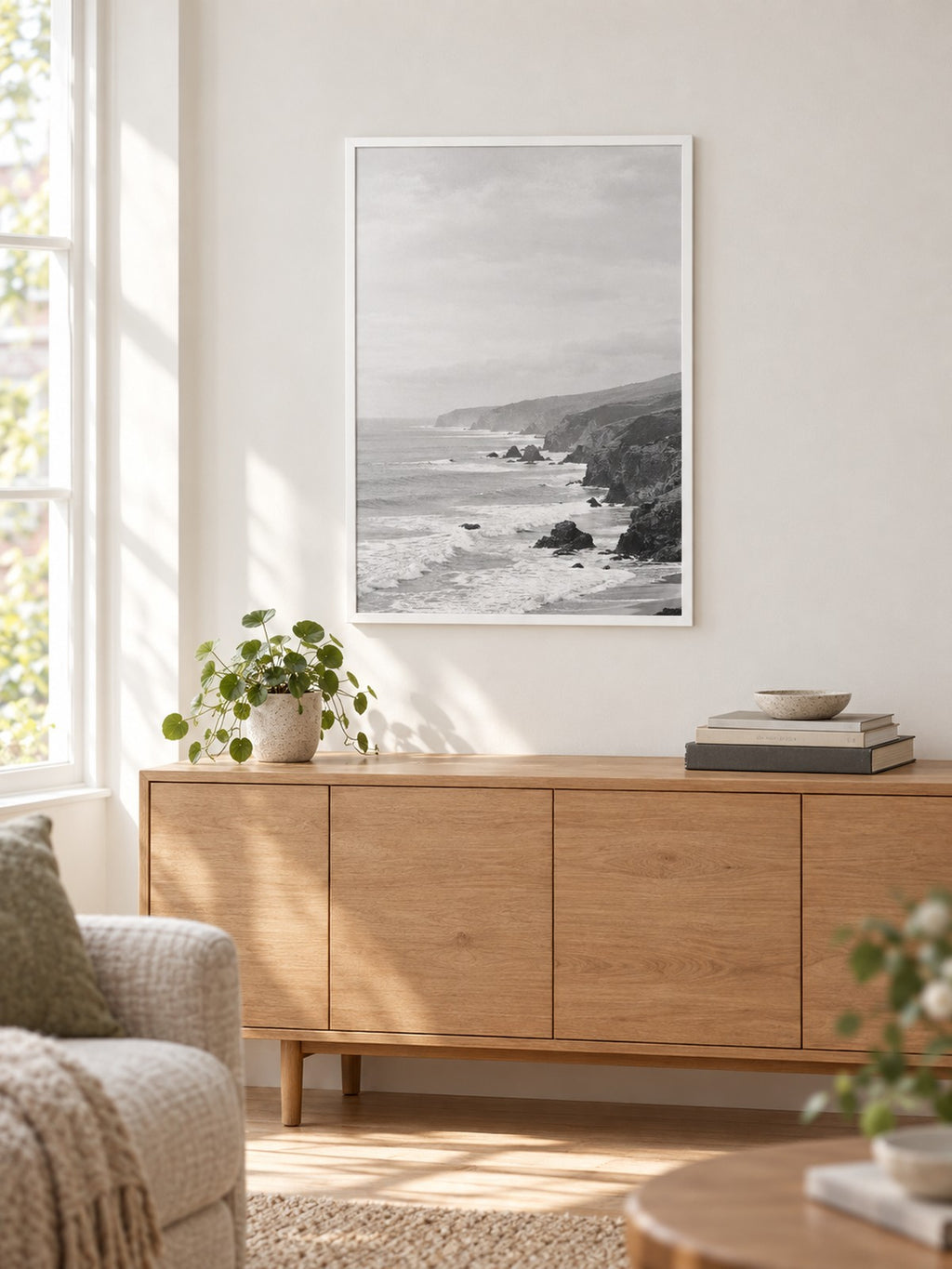 Illustrative scene: white 24x36 MCS poster frame hung above a sideboard in a living room