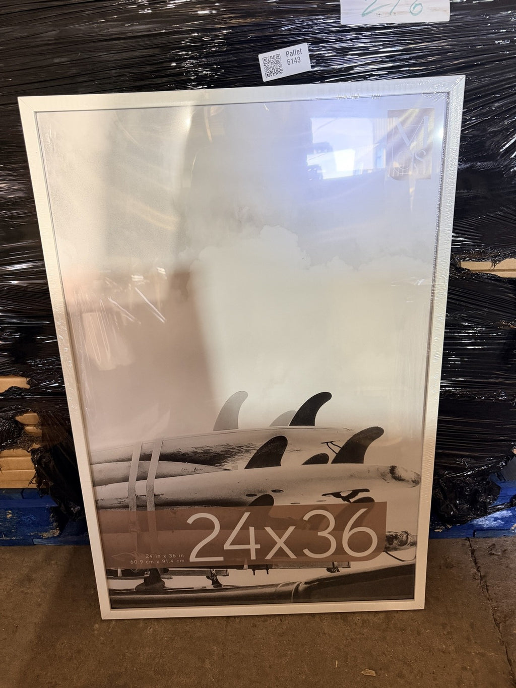 Real photo: MCS 24x36 white poster frame out of the carton, protective film still on, in our warehouse