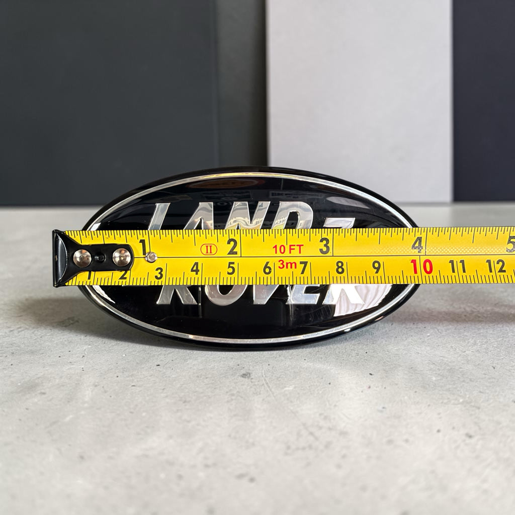 Land Rover oval badge width measured at approx 105 mm