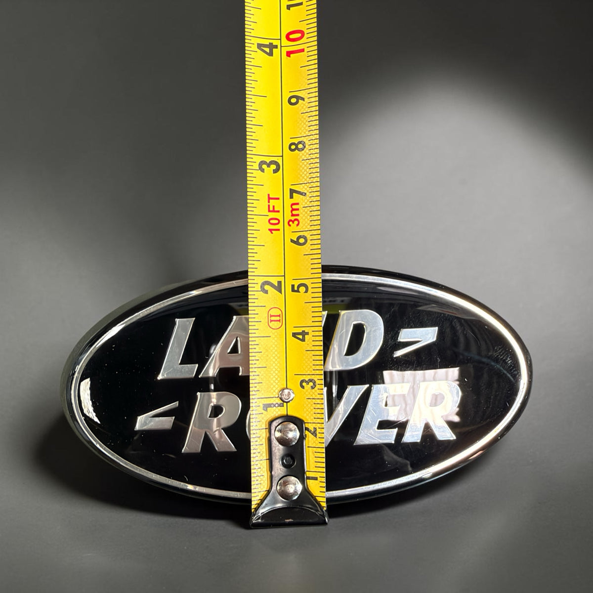 Land Rover oval badge height measured at approx 53 mm