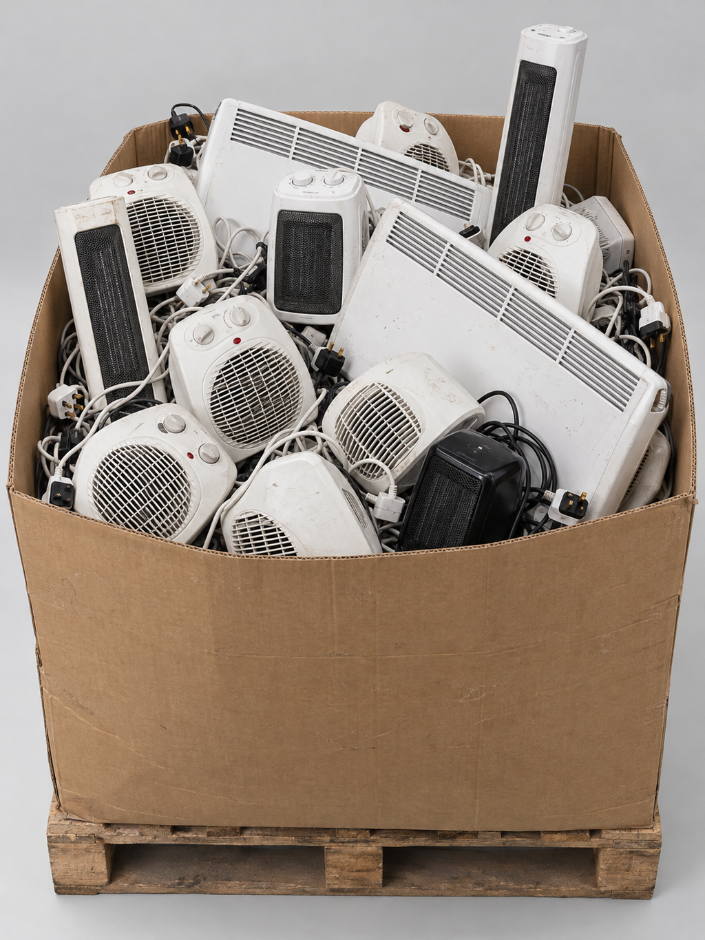 Box pallet of loose heaters sold as spares or repairs – studio image