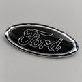 Black and chrome-effect oval badge for Ford – studio photo