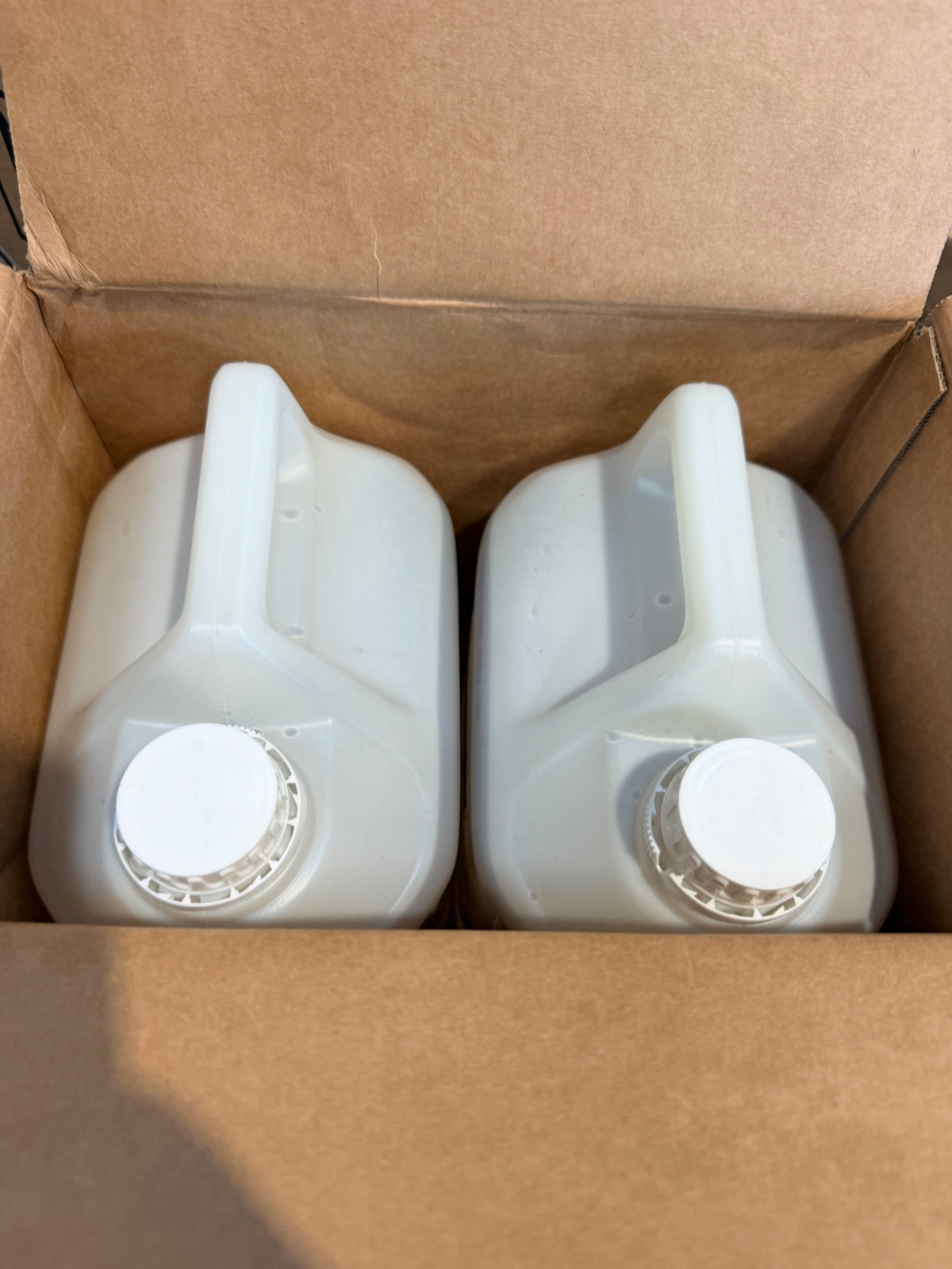 Suma Nova Pur-Eco L6 case opened showing two sealed 5L canisters
