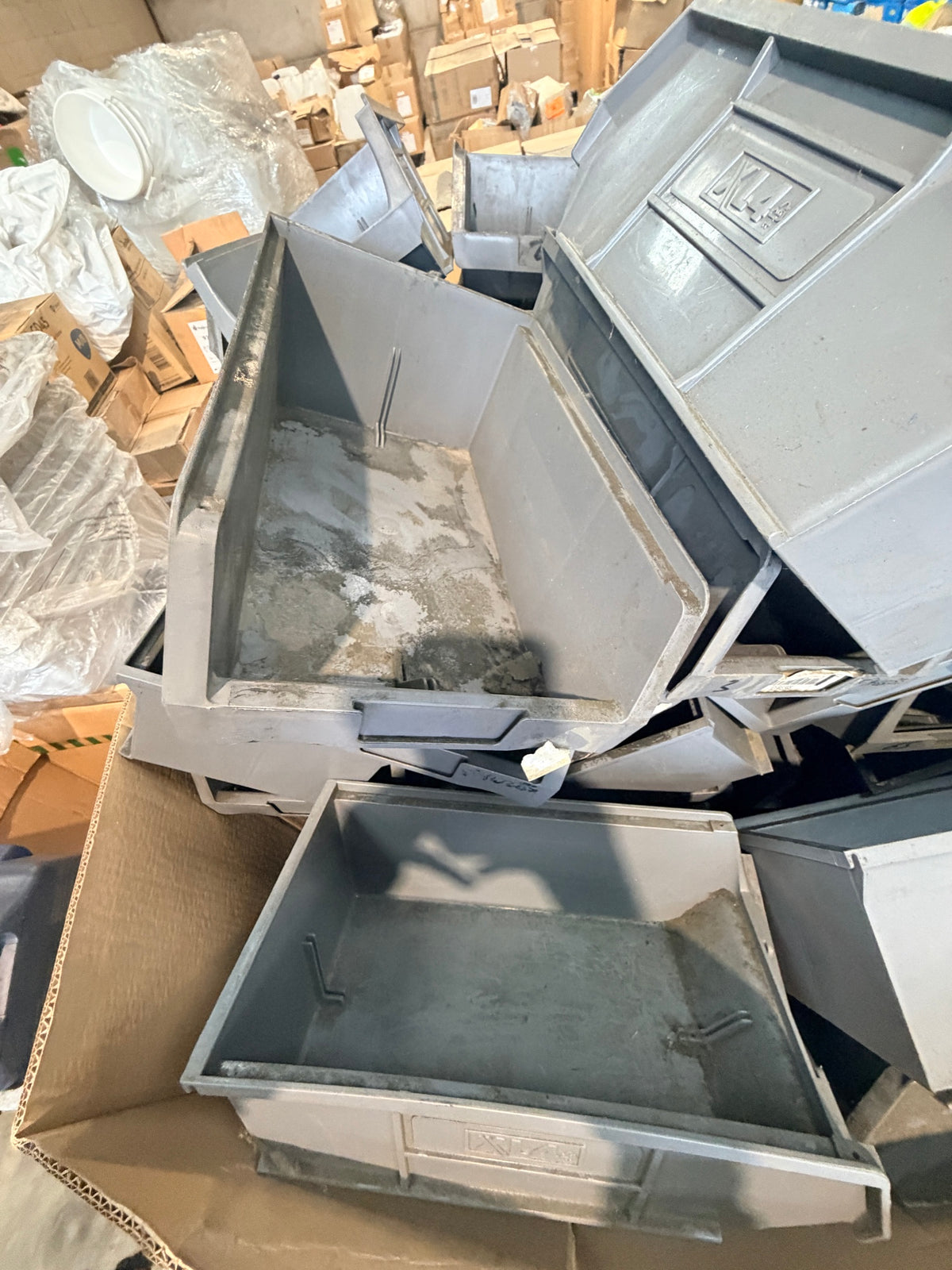 Close-up of bin interiors showing dust and residue