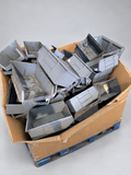 Box pallet of used grey XL4 picking bins – studio background, bins as photographed